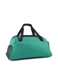 Teal sporttas met zwarte accenten, voorzien van een ritsopening aan de bovenkant, dubbele handgrepen en een zijvak van gaas voor extra opslag. Duurzame stofconstructie.