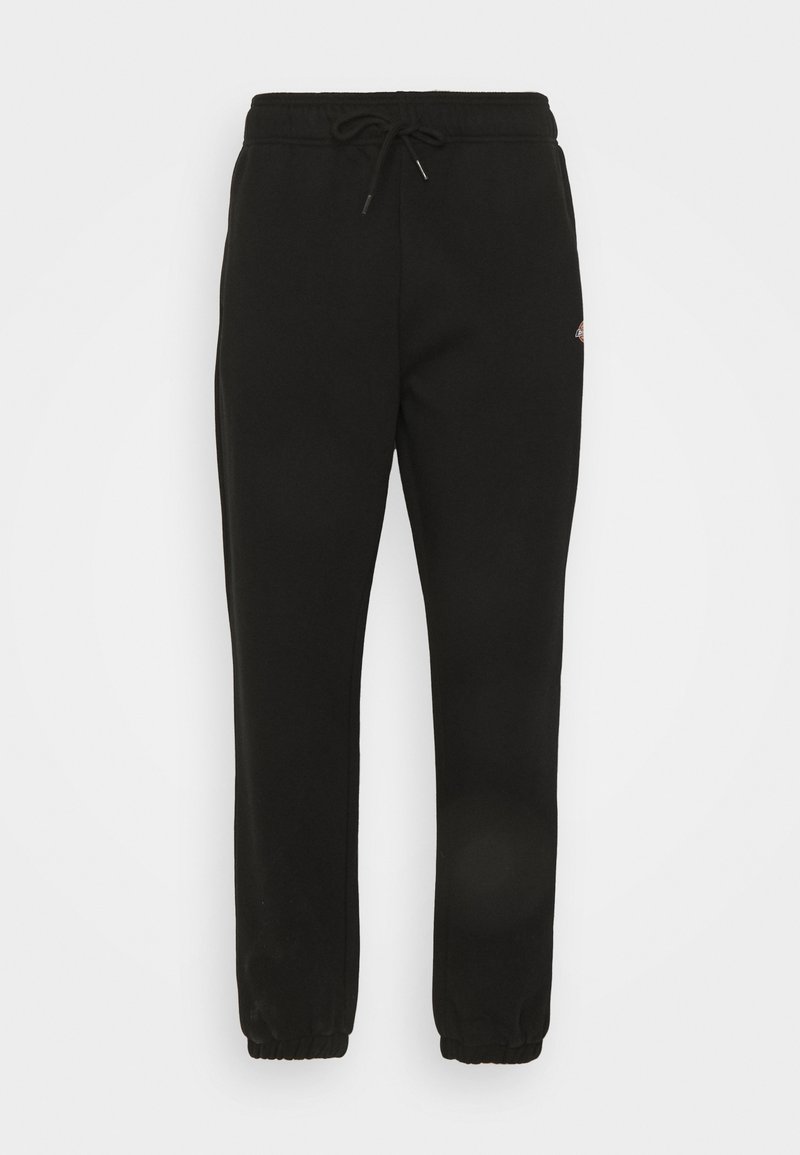Schwarze Jogginghosen aus weichem Material, mit einem elastischen Bund und Zugband sowie elastischen Bündchen an den Knöcheln. Schlichtes Design ohne Muster.