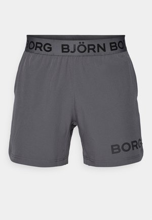 Sive kratke sportske hlače s crnim elastičnim pojasom na kojem su s strane ispisani "BJÖRN BORG" i "BORG" u crnoj boji. Glatka tekstura.