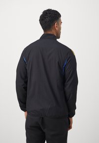 adidas Performance MANCHESTER UNITED EU PRE JACKET - Joukkuetuote - black/hi-res blue/tribe yellow