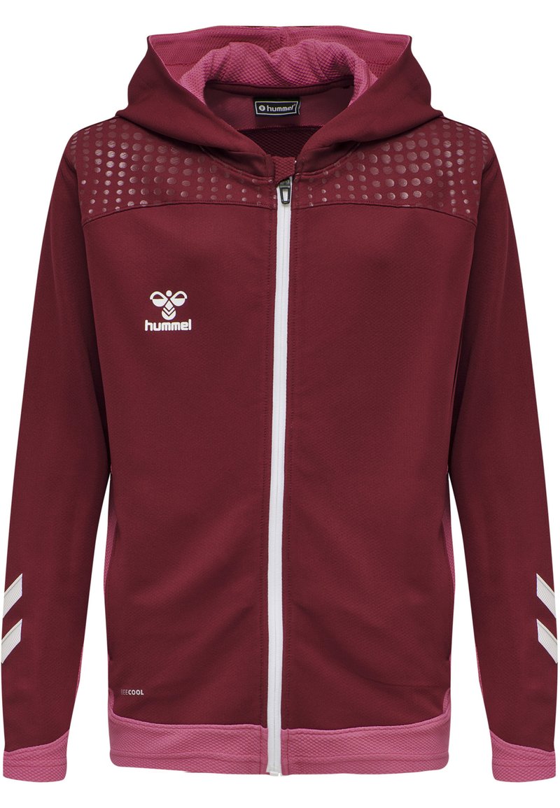 Sudadera con cremallera de color marrón, hecha de tejido texturizado. Presenta detalles en color rosa, un patrón de puntos en los hombros y franjas blancas en las mangas.