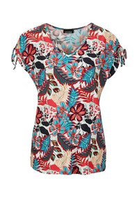 Korte mouw top met bloemenpatroon en een V-hals, in levendige tinten van rood, blauw en zwart op een lichte achtergrond.