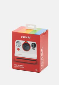 Red box packaging for Polaroid Now Instant Camera; features white front with a black lens, red accents, and colorful striped top.