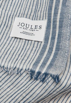 Blåt og hvidt stribet stof med flossede kanter og en hvid label med teksten "Joules Est. 1989 Et beklædningsstykke af overlegen kvalitet."