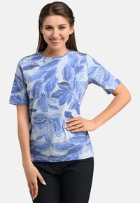 Blue short-sleeve t-shirt featuring a leaf pattern in varying shades of blue on a light blue background; soft fabric and relaxed fit.