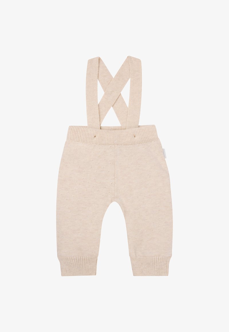 Beige gebreide overall met kruislingse schouderbanden, geribbelde taille en manchetten, met een subtiele stippenstructuur over de gehele stof.