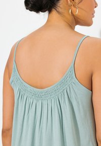 Ulla Popken SMOCKED NECK SPAGHETTI STRAP - Top - light moss green