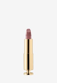 Rossetto con tubetto dorato, caratterizzato da una punta rosa soft incisa con "BABOR". Il design è elegante e con una texture liscia.