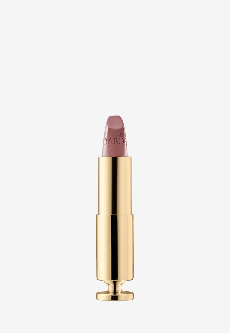 Rossetto con tubetto dorato, caratterizzato da una punta rosa soft incisa con "BABOR". Il design è elegante e con una texture liscia.