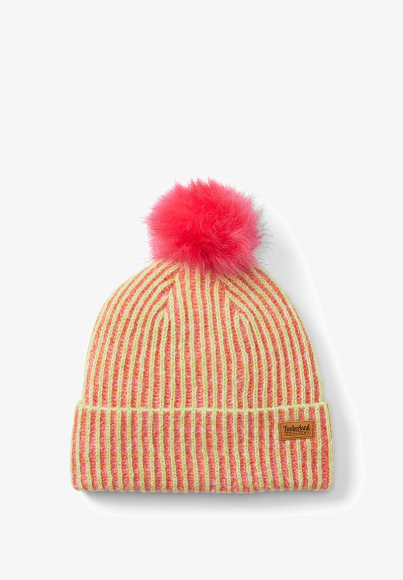 Randig stickad mössa i gult och rosa med en fluffig rosa pom-pom på toppen. Har en vikbar kant och en liten tyglogotyp.