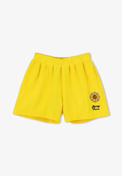 Shorts en coton jaunes avec une taille élastique, ornés d'un motif de tournesol et de "Glengo Paris" brodé en noir. Texture douce.