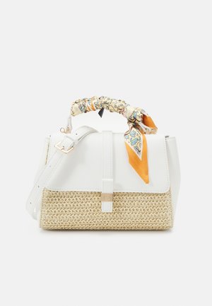 White and beige woven handbag with a top handle wrapped in a floral orange scarf and an adjustable shoulder strap.