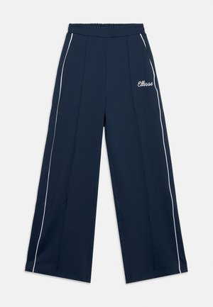Navy blue wide-leg pants with white side piping, elastic waistband, and “Ellesse” logo on left thigh.