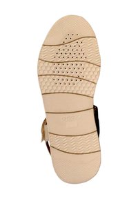 Geox sandaalzool, beige rubbermateriaal met gevarieerde textuurpatronen, waaronder visgraat en perforaties voor ademend vermogen.