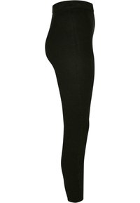 Svart ribbestrikkede leggings med høy midje, med en glatt tekstur og en tettsittende silhuett, ideelle for komfort og allsidighet.