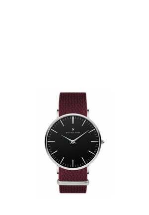 Minimalist wristwatch with black round face, silver case, slim silver hands, simple hour markers, and textured dark red woven strap.