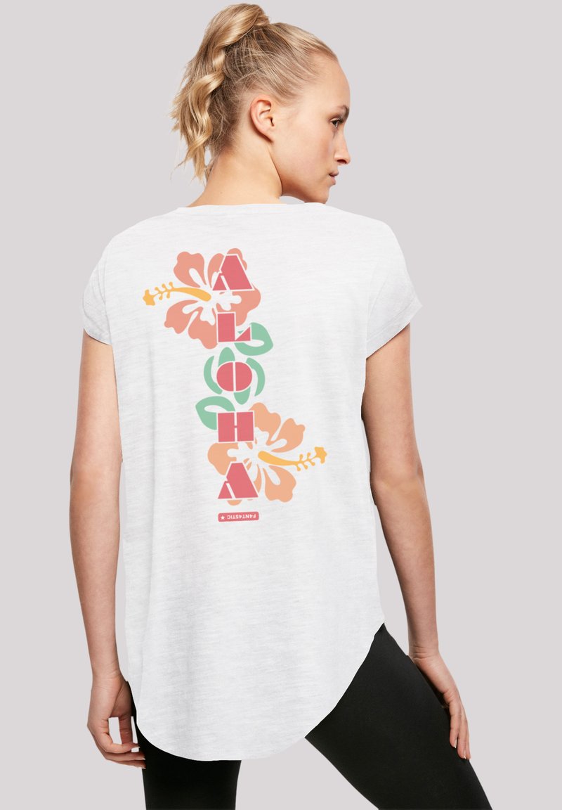 White short-sleeve T-shirt with a colorfully printed "ALOHA" text and hibiscus flowers on the back, featuring a curved hem and relaxed fit.
