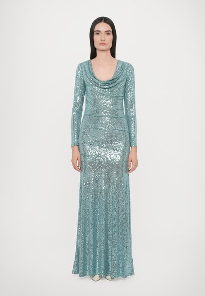 Sequin evening gown in light turquoise with a draped cowl neckline, long sleeves, and fitted silhouette, extending to a flared hemline.