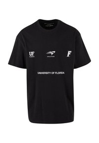 Crna pamučna majica sa prednjim logotipima: "UF", "UPSCALE STUDIOS" i "UNIVERSITY OF FLORIDA" u bijeloj i sivoj boji. Kratki rukavi, opušteni kroj.