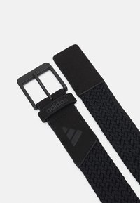 Black woven belt with a matte black metal buckle, featuring a soft material end tab embossed with a logo and distinctive three-stripe design.