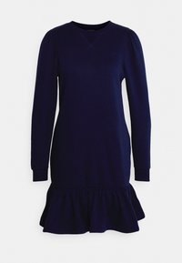 Marinblå sweatshirtklänning med långa ärmar, rund halsringning och volangdetalj i fållen. Mjuk material med subtila sömdetaljer nära kragen.