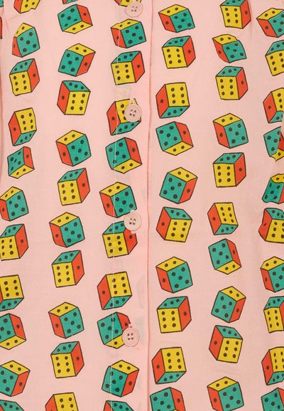 Pink fabric with a repeating pattern of colorful dice, featuring red, yellow, green, and blue accents. Two pink buttons are visible.