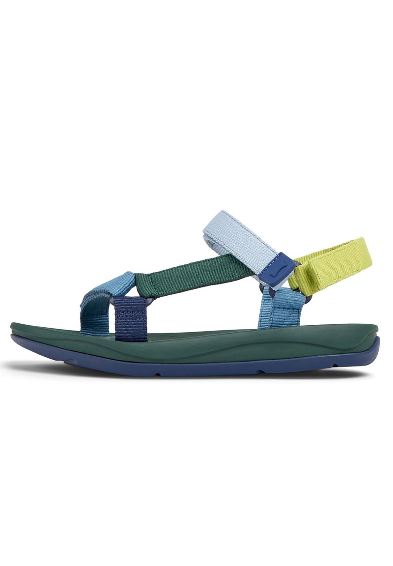 Bunte Sandalen mit grünen, blauen und gelben Riemen sowie verstellbaren Verschlüssen. Strukturiertes Profil für zusätzlichen Halt und Komfort.