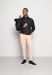 Nike Sportswear REVIVAL - Calças de fato de treino - white ony