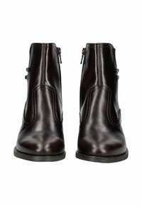 Bottines en cuir marron foncé avec une texture lisse, présentant des zips latéraux et un matériel décoratif minimaliste sur le côté extérieur.