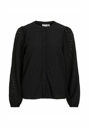 Czarna bluzka z teksturowanym wzorem z koronki, okrągłym dekoltem i długimi bufkowatymi rękawami. Z przodu zapięcie na guziki oraz delikatne marszczenia przy mankietach.