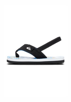 Svart flip-flop med en strukturerad rem, blå skuminnersula med tropiskt mönster, vit mellansula och svart gummiyttersula.