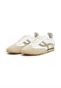 Low-top sneakers featuring a white leather upper, beige suede accents, a textured rubber sole, and beige and navy detailing on the sides.