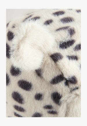 Valekunstnahk kangas kreemika aluse ja mustade laikudega, millel on pehme kurruline detail. Tekstuur on koheva ja kergelt läikiv.