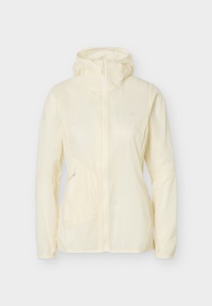 Šviesios kremo spalvos gobtuvu minkiama striukė su priekiniais užtrauktukais ir užtrauktuku šonine kišene, rodoma ant paprasto balto fono.