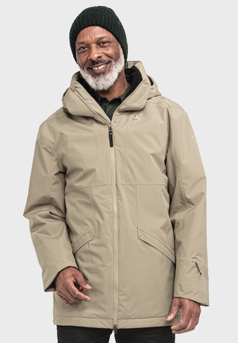 Beige wasserdichte Jacke mit Kapuze, Reißverschluss und Seitentaschen. Sie verfügt über einen strukturierten Stoff und verstellbare Bündchen für zusätzlichen Komfort.