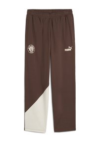Braune Jogginghose mit cremefarbenen Seitenstreifen, elastischem Bund und Taschen. Enthält das FC St. Pauli-Logo und Puma-Branding in Weiß.