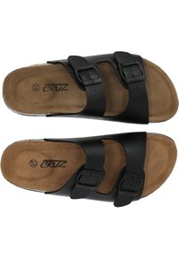 Svarta sandaler med två justerbara remmar, med metallspännen; sula har en beige mockaliknande yta; logotyp tryckt i svart på sulan.