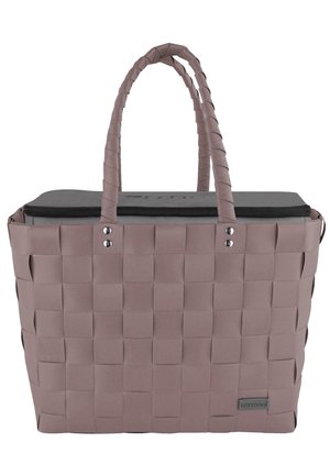 Woven tote bag in soft pink with a rectangular shape, featuring two handles, a contrasting black zippered top, and metallic accent details.