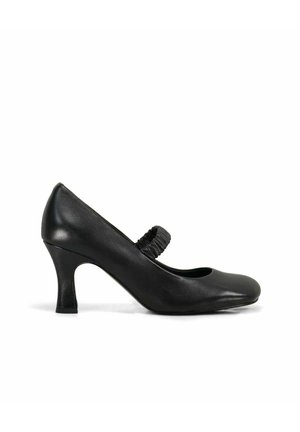 Décolleté in pelle nera con tacco medio, punta arrotondata e fascia elastica sul collo del piede, mostrata di profilo su sfondo bianco.