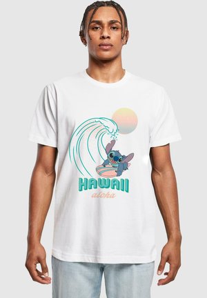 White cotton t-shirt featuring a graphic of a cartoon character surfing, with waves, a sun, and the text "HAWAII aloha" in vibrant colors.