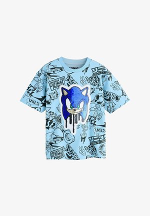 Light blue short-sleeve shirt featuring blue sequined Sonic the Hedgehog face and black comic-style sketches and text all over.