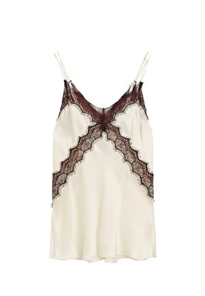 Luxuriöses cremefarbenes Top mit zarter burgunderroter Spitzenverzierung, die ein gewelltes Design aufweist und verstellbare Spaghettiträger hat. Glattes Satinmaterial.