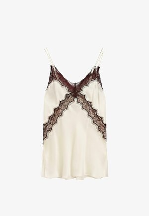Luxe ivoork kleurige camisole met delicate bordeaux rode kantafwerking, voorzien van een golvend ontwerp en verstelbare spaghettischouderbandjes. Gladde satijnen stof.