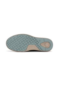 Suela de zapato con un borde de color marrón claro y una superficie de goma turquesa texturizada que presenta patrones circulares y ovalados para agarre.