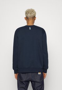Carhartt WIP GEO SCRIPT - Camisola - mizar