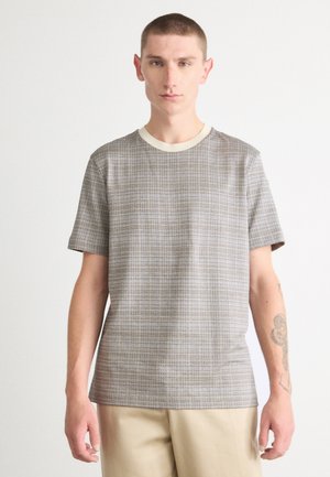 Short-sleeve shirt in a checkered pattern with neutral tones, featuring a cream crew neckline and a relaxed fit. Made of lightweight fabric.