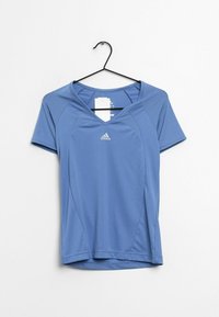 Vaaleansininen urheilupaita lyhythihaisilla ja V-pääntiellä. Sisältää Adidas-logon ja sileän, hengittävän kankaan rakenteen.