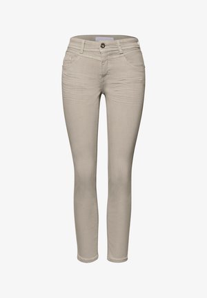 Pantaloni beige da donna a taglio aderente con bottone frontale, cerniera, passanti per cintura e tasche anteriori e posteriori.