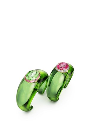 Green transparent resin cuffs with octagonal gemstones—one light green, one pink—surrounded by pink and clear accents. Smooth texture.