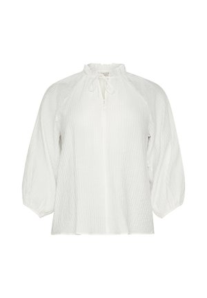 Blouse blanche en tissu texturé et froissé. Présente un col haut avec un lien et des manches légèrement bouffantes. Fermeture à boutons simple.